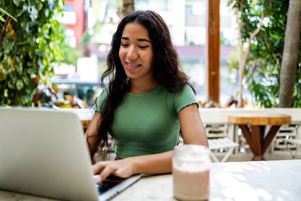 istock Young woman working from the cafe 1453156182