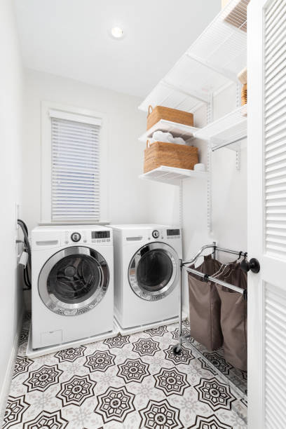 istock A laundry room with a mosaic tile floor. 1453157481
