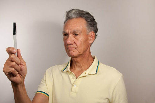 Mature Man 60plus doing Eye Exercises to improve his vision