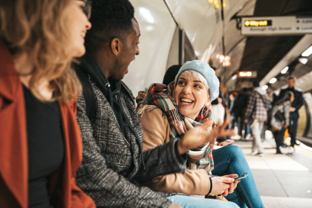 group of multi ethnic friends moving by subway - reaction tube imagens e fotografias de stock