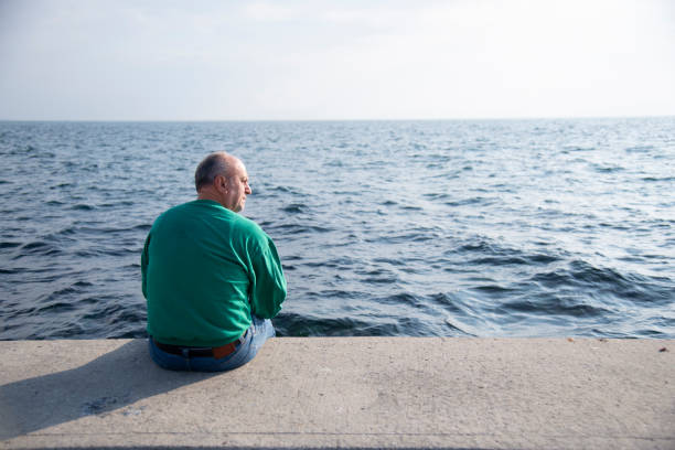 istock Mature man by the sea 1453165342