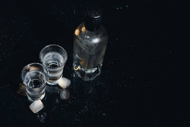 istock Vodka. Shots, glasses with vodka with ice .Dark background. Copy space .Selective focus. 1453166461