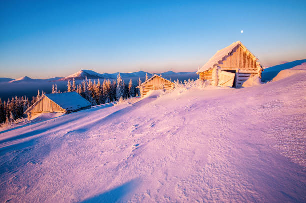 istock Beautiful winter landscape with abandoned cabins at sunrise 1453166867