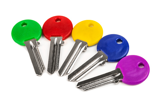 Collection of colored keys on white background