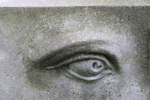 Upclose Of A Large Stone Eye On A Statue