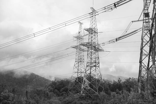 Power line high in the mountains. View of the power line in the fog.