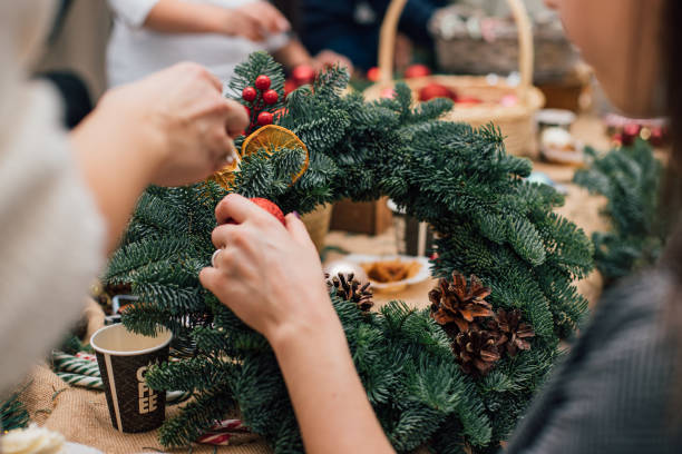 istock Photo of work process of creating christmas wreath at masterclass 1453170029