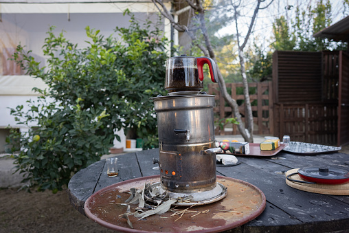 Traditional Turkish tea pot on coal oven