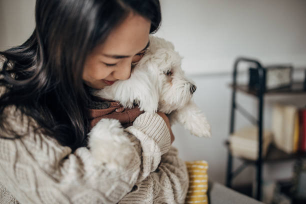 istock Woman hugging her dog 1453170358