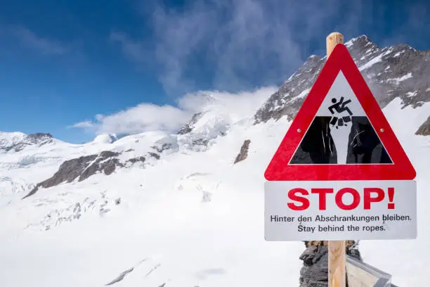 Warning sign in the Swiss alps in the mountain glaciers