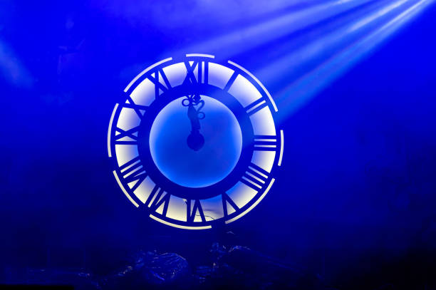 istock neon light decorative lighting clock with roman numerals, new year event decoration, lspotlight lights 1453171497