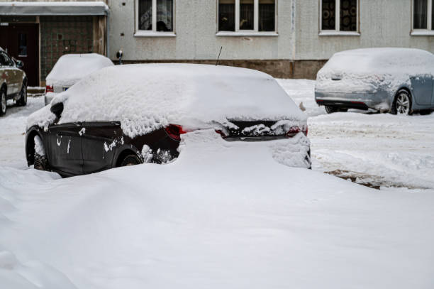 istock Snow-covered cars in the yard. 1453173915