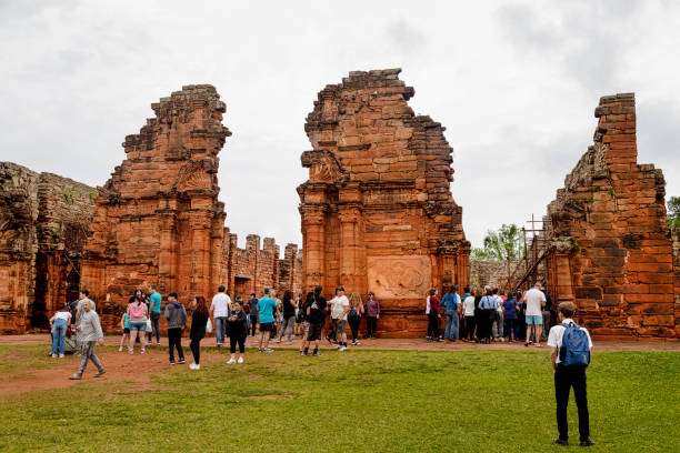 Group of tourists enter the church in the Ruinas de San Ignacio Mini stock photo