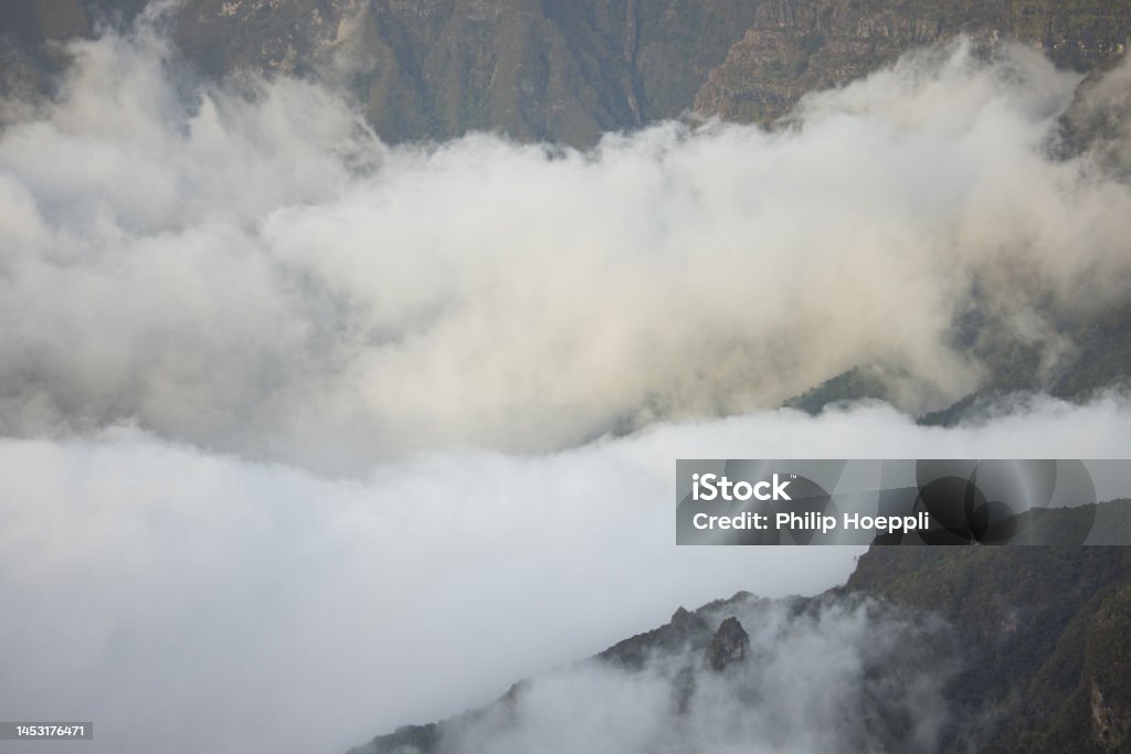 Epic misty vibes in the mountains of Madeira at a viewpoint called Bica da Cana. Wonderful landscape in Portugal, Madeira. Aerial View Stock Photo