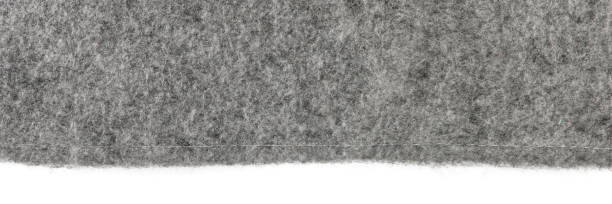 filztextur. textur von grau fühlte sich isoliert auf weißem hintergrund an. abstrakter hintergrund mit natürlichem grauem filz. hochauflösendes texturfoto - elefantenohr stock-fotos und bilder