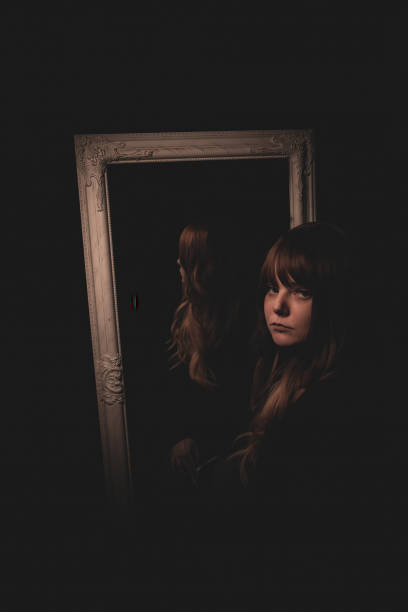 istock A young girl in front of a mirror 1453181569