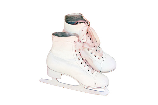 White figure skates stand, isolated on a white background