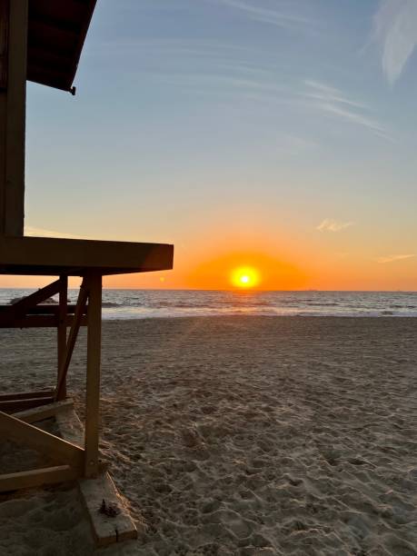 istock Beach sunset and lifeguard tower 1453185454