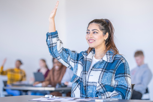 University Students Asking Questions In Class Stock Photo - Download