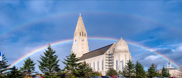 Overlooking Reykjavik, this landmark church is a must-visit attraction. On this day, all the better under a glorious double rainbow. g