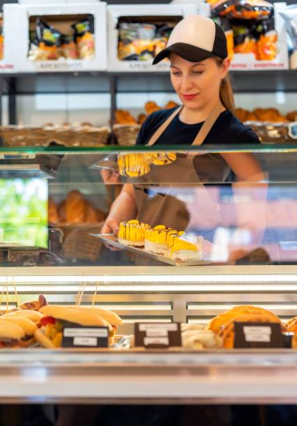 istock enterprising woman placing her cakes 1453197847