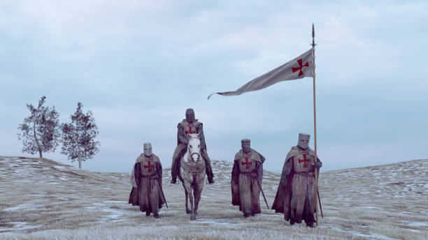 Medieval soldiers on crusade or a conquest during winter Soldiers from medieval times walks next to each other. They wear armor and helmets. One of them rides a horse. knights templar stock pictures, royalty-free photos & images