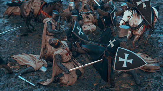 Caos en un campo de batalla medieval con soldados luchando photo