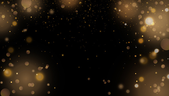 Christmas background. Shimmering blue dust. Magic bright shimmering shiny bokeh particles.