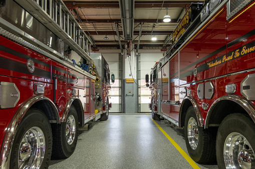 Solomons, Maryland USA Dec 4, 2022 Firetrucks parked inside the local volunteer firehouse.