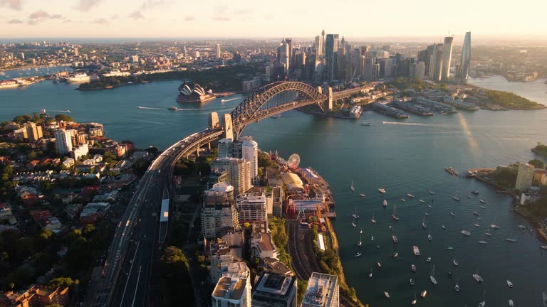 Aerial drone view of Sydney City and Sydney Harbour showing Sydney Harbour Bridge and Lavender Bay in the late afternoon