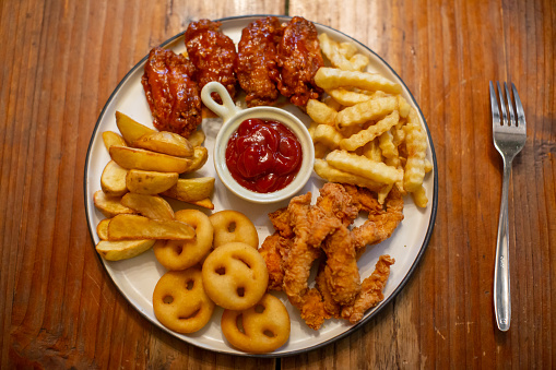 Chicken and chips platter and tomato sauce