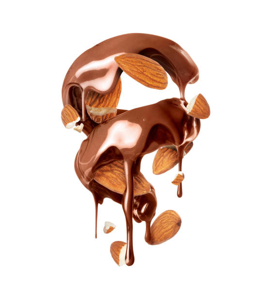 istock Melted chocolate in a twisted shape with crushed almonds closeup isolated on a white background 1453216929
