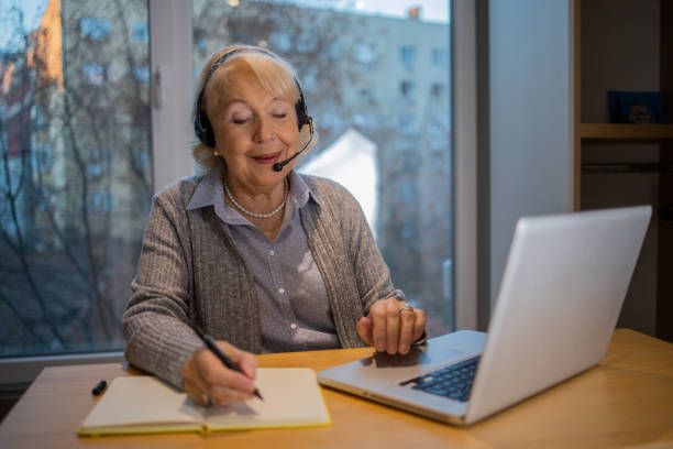 istock Senior woman working from home 1453217313