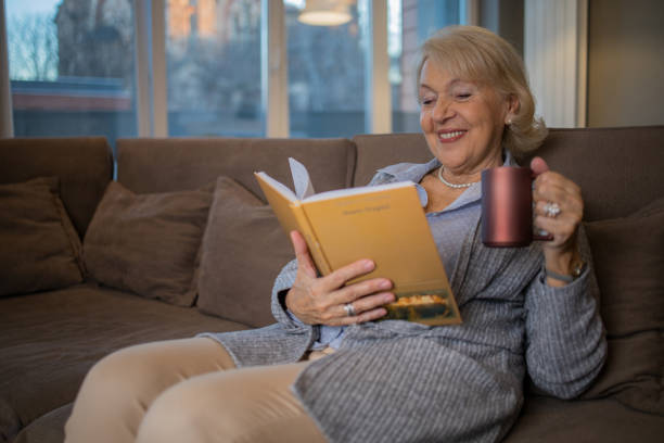 Woman relaxing and reading a book