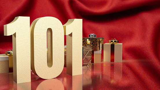 The gold number 101 and gift box on red silk for business concept