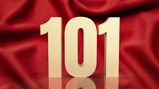 The gold number 101 on red silk for business concept