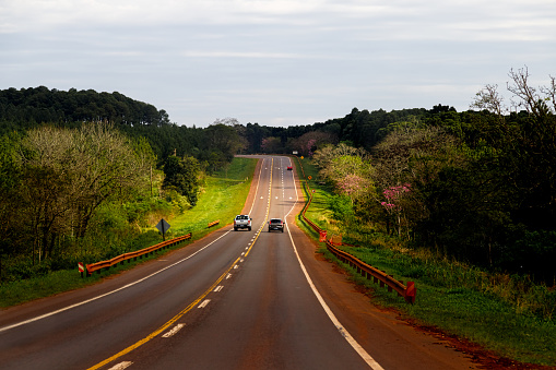 Pickup truck overtakes a car on Highway 12 in Misiones, Argentina