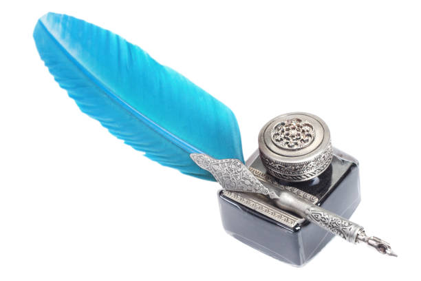 istock Old blue feather fountain pen with inkwell on white background 1453224540
