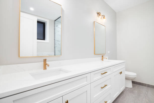 istock A bathroom's white cabinet with gold accents. 1453224570