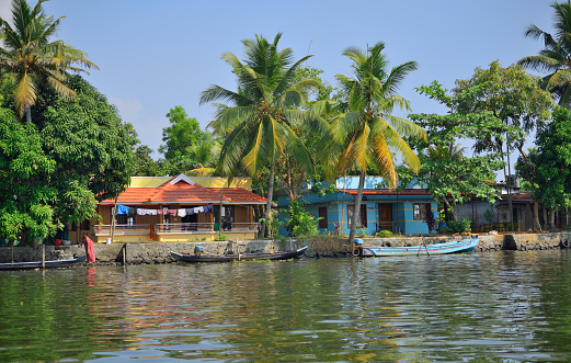 Alleppey, India - March 03, 2018: A village on the banks of backwaters in Kerala.