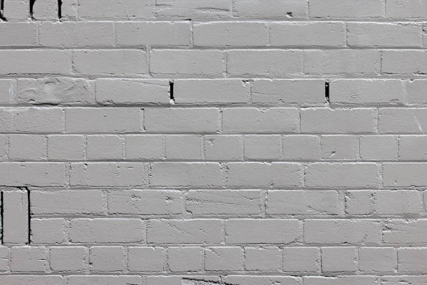 Close-up on an old painted brick wall.