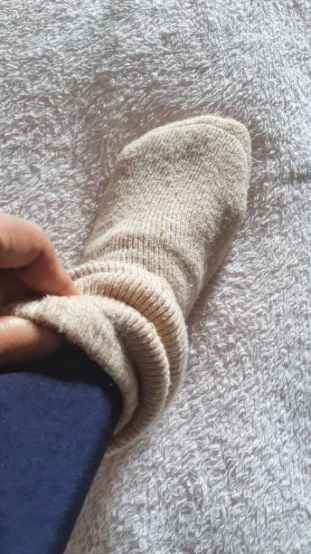 istock A woman's feet in woolen socks on a fur blanket 1453240962