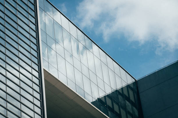 istock Modern building. Modern office building with facade of glass 1453243120