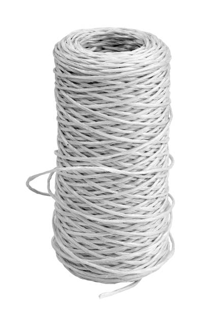 istock Bobbin of white thread isolated on white background with reflection. 1453249692
