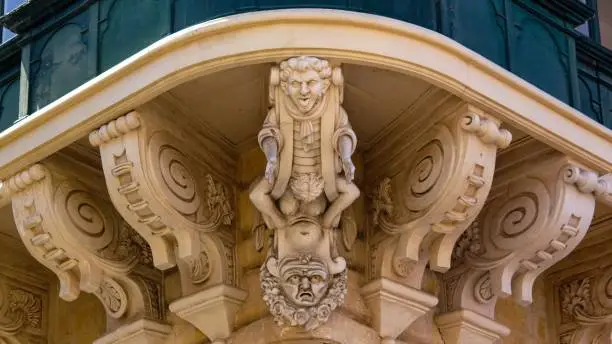 Decorative Corbel holding a corner balcony of the Grandmaster's Palace Valletta, Malta at Republic Street corner with Archbishop Street