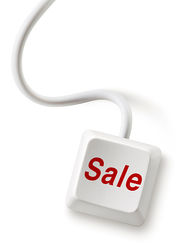 Computer key Sale. Photography isolated on white in high resolution.