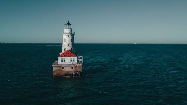 istock Chicago Harbor Lighthouse isolated on the Chicago River against a blue sky background 1453257241