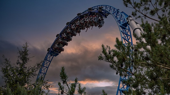 Red roller coaster and big blue sky