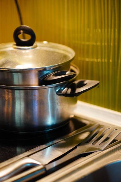 istock Vertical shot of saucepans on the stove 1453258672