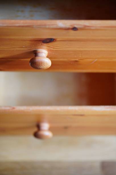 istock Vertical selective focus shot of an open wooden drawer 1453258673